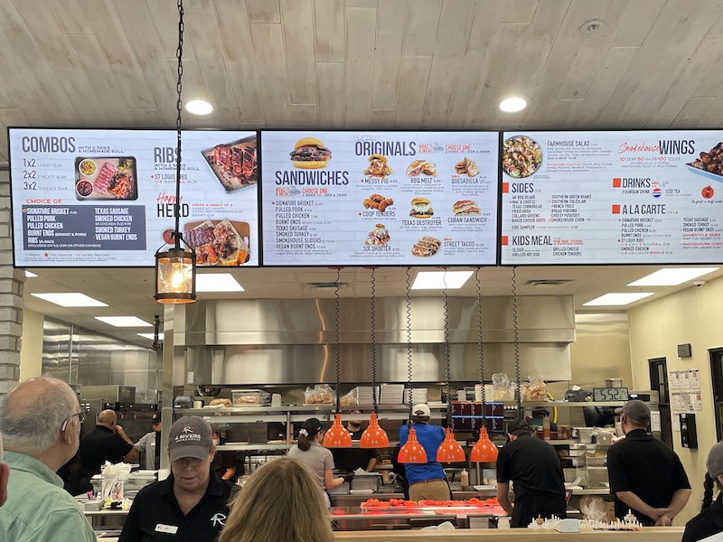 Menu board with BBQ options at 4 Rivers Smokehouse Middleton
