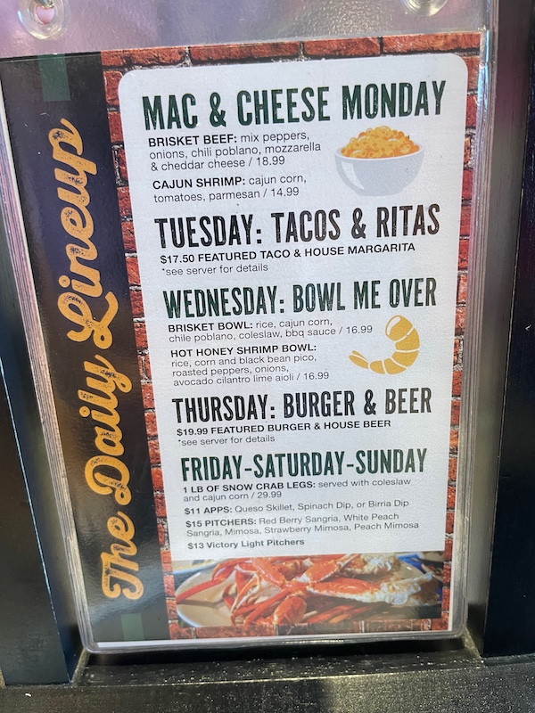 Daily specials board at Victory Sports Grill Middleton showing weekly deals.