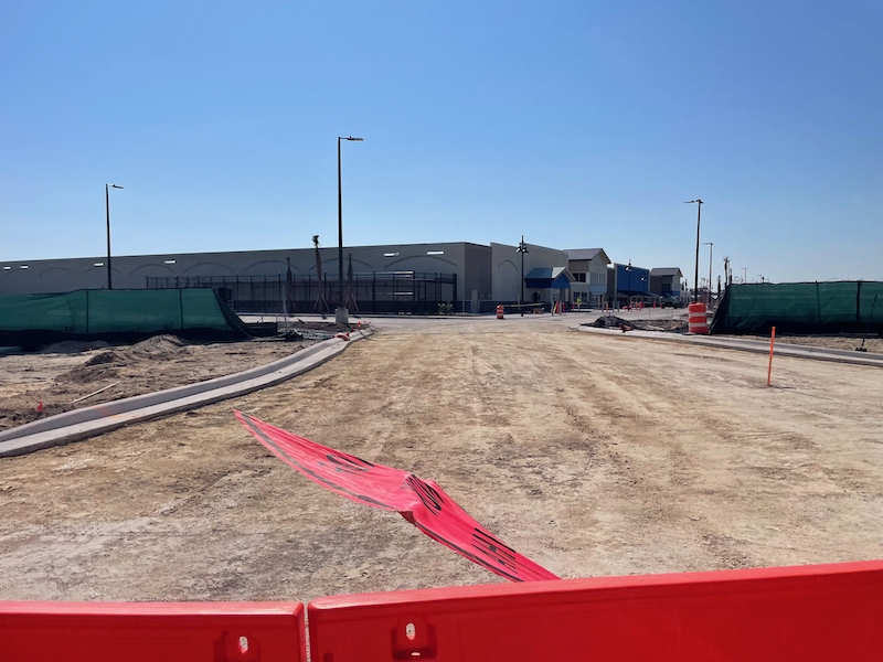 Construction crew installing underground lines for the Walmart SR-44 traffic light near the main entrance