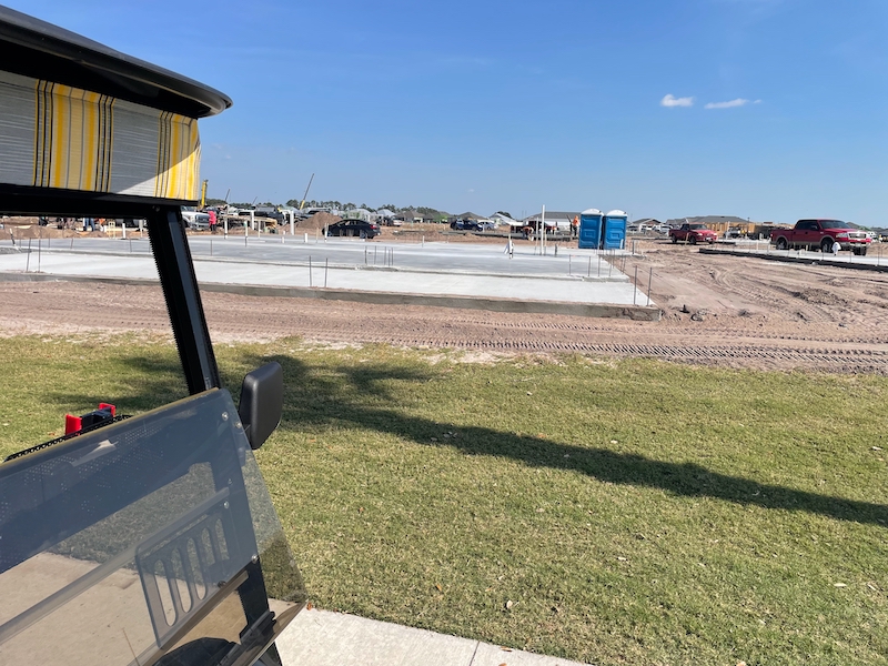 New homes under construction next to cart path at Woodlands Golf Course The Villages
