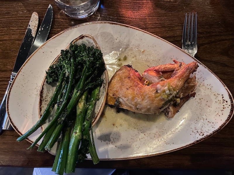 Half chicken entrée with broccolini