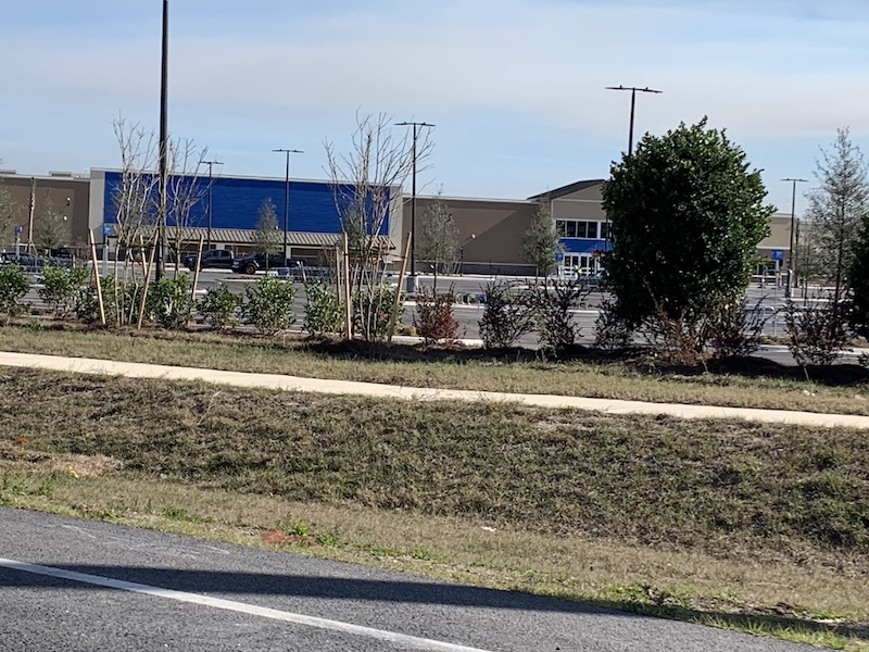 New Walmart Supercenter on SR-44 in The Villages with finished parking lot and storefront, January 2026