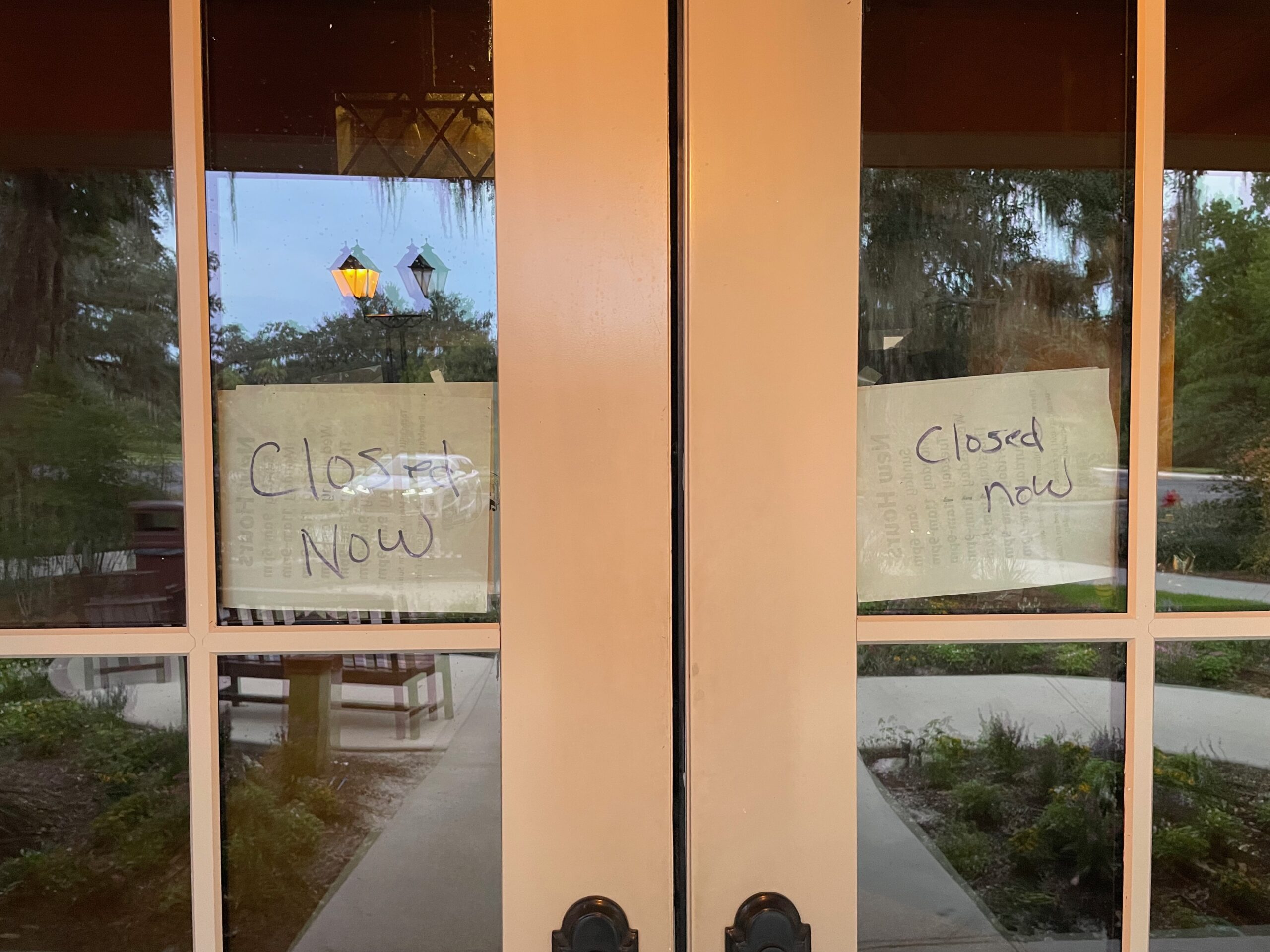 Handwritten Closed Now signs posted on the front doors of Fenney Grill